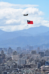 Military helicopter flying the Taiwanese flag on Taiwan National Day