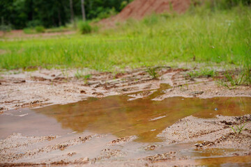 A basin with muddy soil during the rainy season