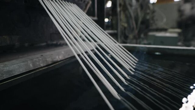 Technology for processing plastic waste into new polymers. Cooling strands in the frame.