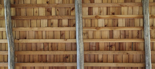 an old wooden roof with wooden beams 
