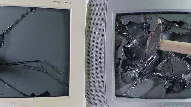 Smashed old kinescope television. Sledgehammer smashes old TV. Broken monitor