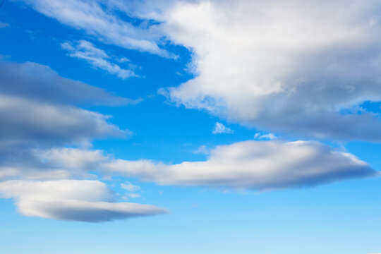 fluffy clouds on a blue sky. beautiful nature background in spring