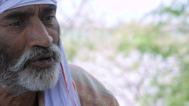 Old man from rural India wearing a Safa. An Indian villager in traditional clothes