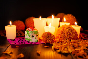 Sugar skull with Candles, Cempasuchil flowers or Marigold and Papel Picado. Decoration...