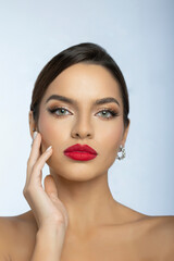 Fototapeta premium Fashion portrait of a beautiful young woman with make up