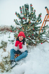 beautiful woman decorating christmas tree