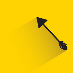 hunting arrow with shadow on yellow background
