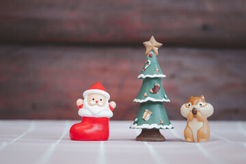 Ceramic doll Santa Claus, Christmas tree and squirrel.