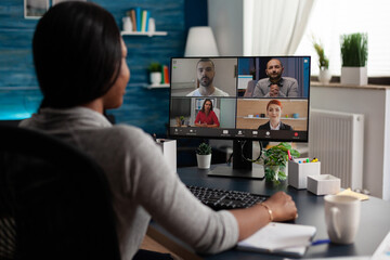 Worker using video call communication with colleagues to do business meeting and remote work on...