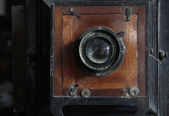 Detail of a vintage camera. Close-up of the front lens