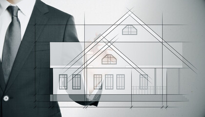 Businessman drawing creative house project blueprint on white background. Construction,...