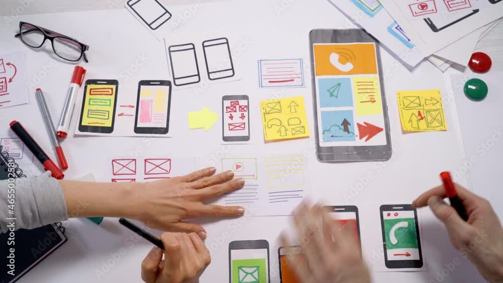 Poster mobile phone interface applications design concept. designers create a web project working at a desk
