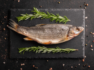 Dried  fish stockfish on a black background. 