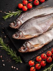 Dried  fish stockfish on a black background. 