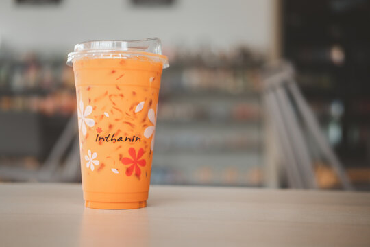 Samut Prakan, Thailand - October 27, 2021 : Thai milk tea take away at Inthanin coffee shop.