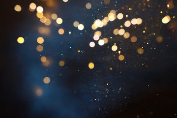 abstract blue, gold and black defocused background. bokeh lights