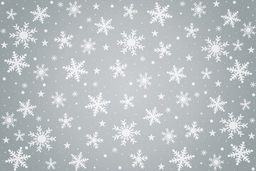 Winter snowflakes falling over silver abstract background.