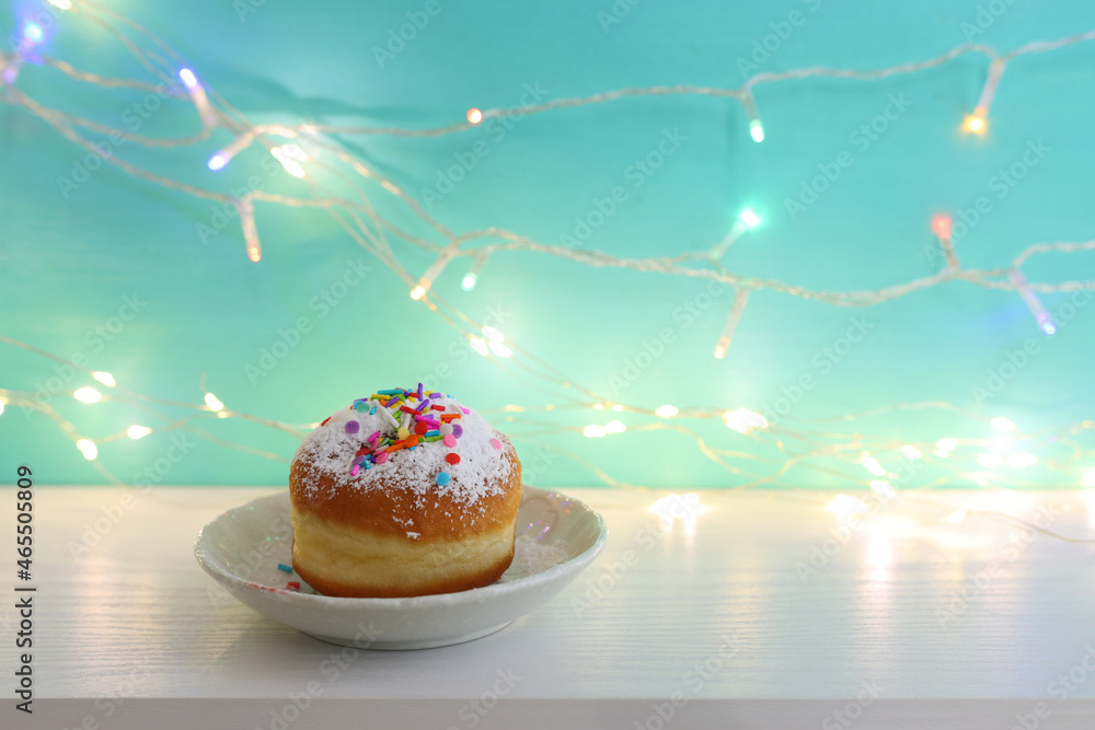 Wall mural image of jewish holiday hanukkah with doughnut