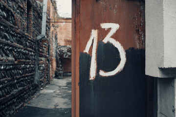 Door with number 13 . Bakers dozen concept 