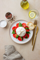 Italian burrata cheese with tomatoes and basil. Salad. Healthy eating. Vegetarian food.