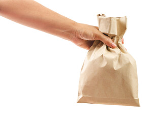 Hand holding paper bag isolated on white background.