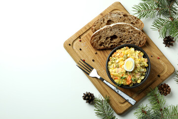 Christmas concept of tasty food with Olivier salad on white background
