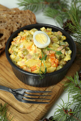 Christmas concept of tasty food with Olivier salad on white background