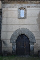  A old door of a medieval church in a town of Cáceres called Granadilla