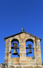An old stone bell tower in a town of Cáceres