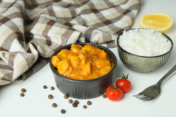 Concept of tasty food with chicken tikka on white background