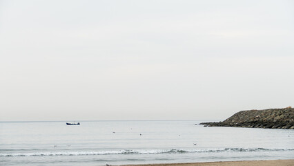 waves on the beach, a boat on the sea, fishing on the sea, a sea background, a fishing boat background, a fishing boat wallpaper, fishing in the sea