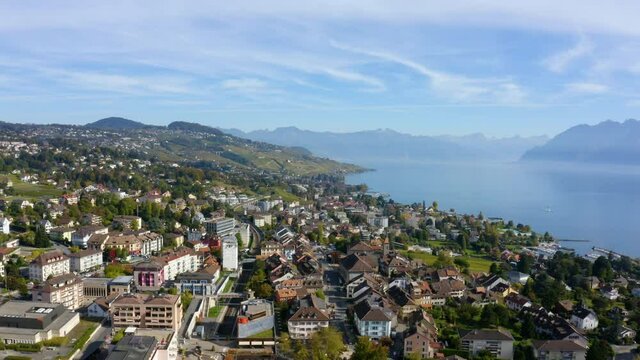 Lakefront Buildings In The Town Of Pully In Lavaux-Oron, Switzerland With View Of Lake Geneva. aerial, lateral view