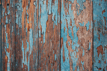 old wooden background with peeling paint 