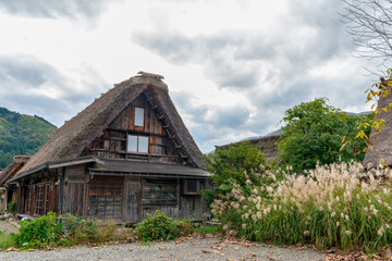 Fototapeta na wymiar Old traditional Japanese house with thatched roof