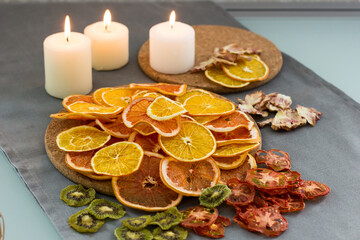 Dried fruits are scattered on the table. apple kiwi grapefruit. assorted