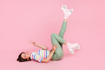 Full size profile side photo of young girl happy positive smile show peace v-sign rider sporty isolated over pastel color background