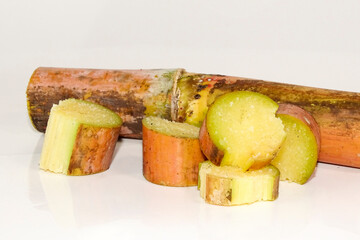 Sugarcane slice isolated on white  background.
