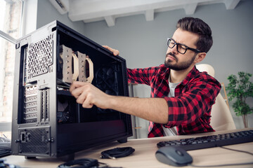 Portrait of nice experienced qualified trendy guy repairing detail pc upgrade motherboard solving...