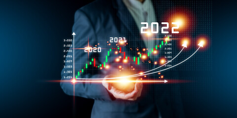 Plan business growth in year 2022 concept. Businessman plan and increase of positive indicators in...