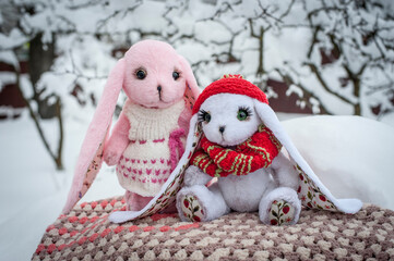 soft toy hare on the background of snow