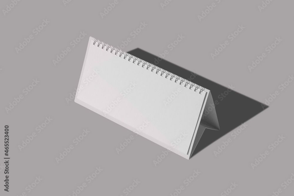 Poster empty blank desk calendar mock up isolated on a gray background. office page organizer, template cal
