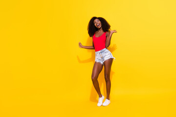 Fototapeta na wymiar Full length body size view of attractive dreamy cheerful girl having fun clubbing isolated over bright yellow color background