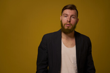 bearded man fashionable hairstyle jacket posing self confidence