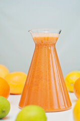 Juicing vegetables and fruits! Bright and colorful fruit drink, oranges, grapes, apples, lemons and limes on a background.