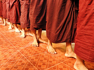 Feet of monks in monastery in Myanmar