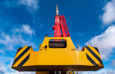 blue sky construction crane big yellow red