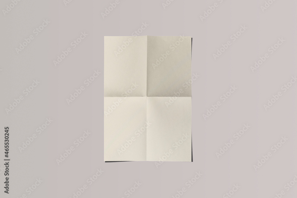 Poster empty blank folded a4 paper mock isolated on a grey background. folded newspaper insert. newspaper p