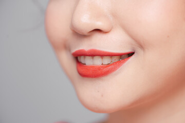 Close-up beauty portrait of woman face with sexy red lips