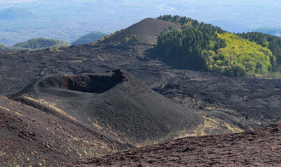 Tourist at the rim of a crater at Etna volcano Sicily © Fran