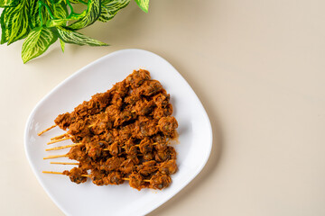 Sate Kerang Or Satay Kerang is a Traditional Indonesian Food made from Shell and covered with sauce. Sate Kerang Angkringan.  Selective focus. macro food.